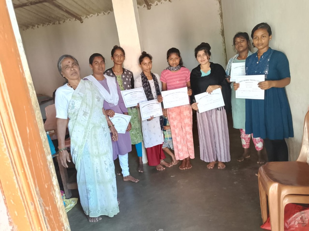 Tailoring Course Graduates displaying course certificates