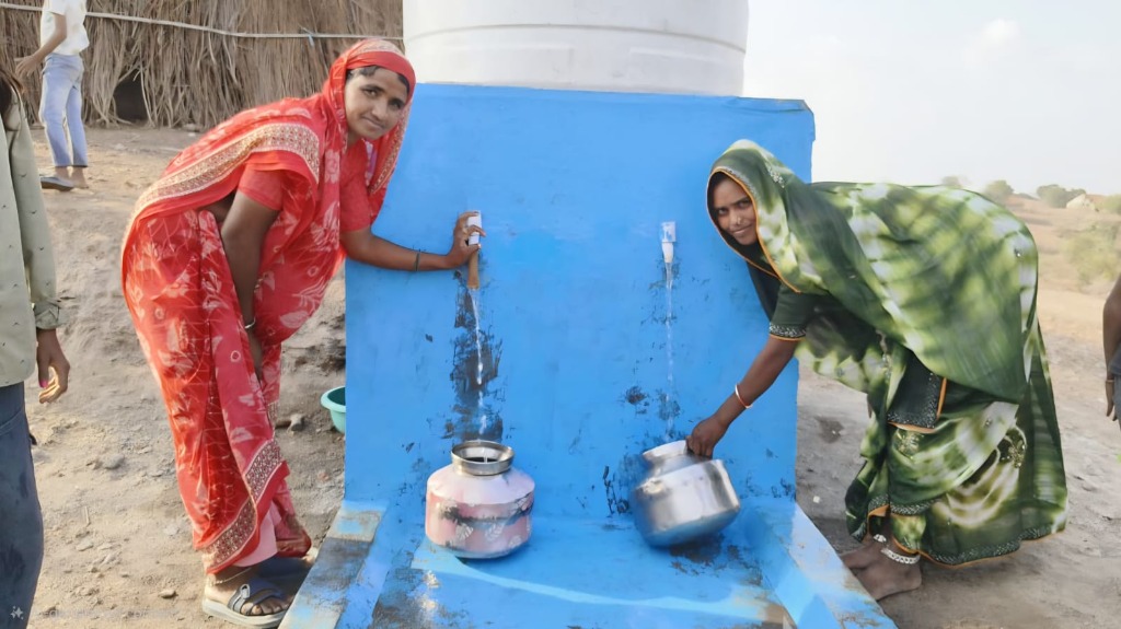 Villagers using community drinking water tap